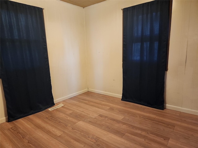 709 S Streeter St, Knoxville, IA 50138 - spare room with baseboards and light wood-style flooring