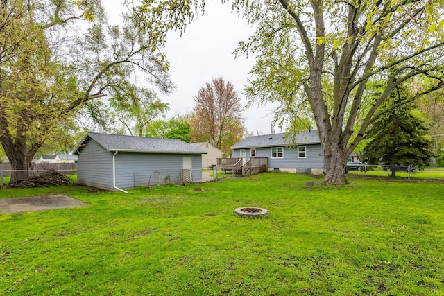 3924 55th St, Des Moines, IA 50310 - view of yard with an outdoor fire pit and a wooden deck