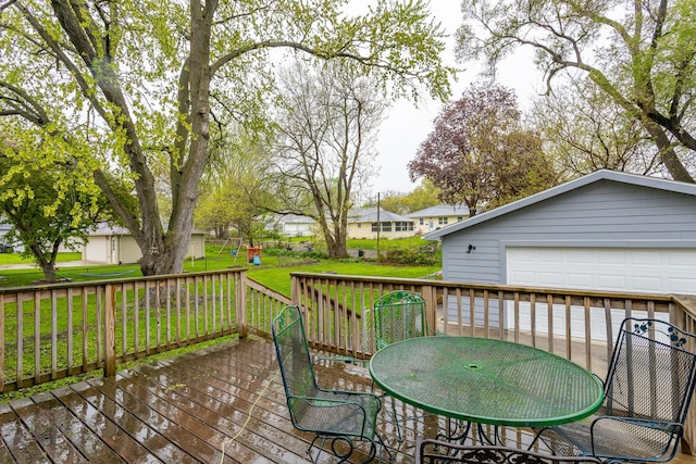 3924 55th St, Des Moines, IA 50310 - deck featuring a yard, a garage, an outdoor structure, and a residential view