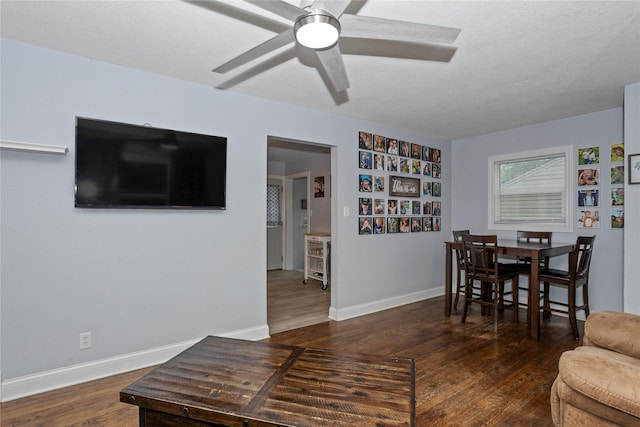 3924 55th St, Des Moines, IA 50310 - living room featuring ceiling fan, wood finished floors, and baseboards