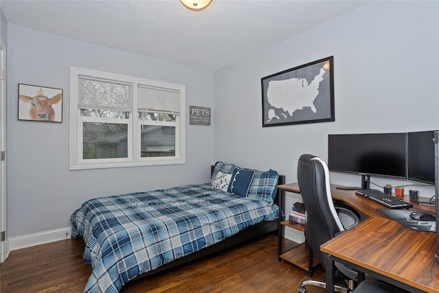 3924 55th St, Des Moines, IA 50310 - bedroom with wood finished floors, baseboards, and a desk
