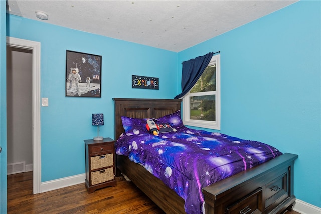 3924 55th St, Des Moines, IA 50310 - bedroom with wood finished floors and baseboards