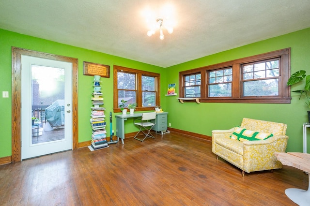 office space featuring baseboards and wood-type flooring