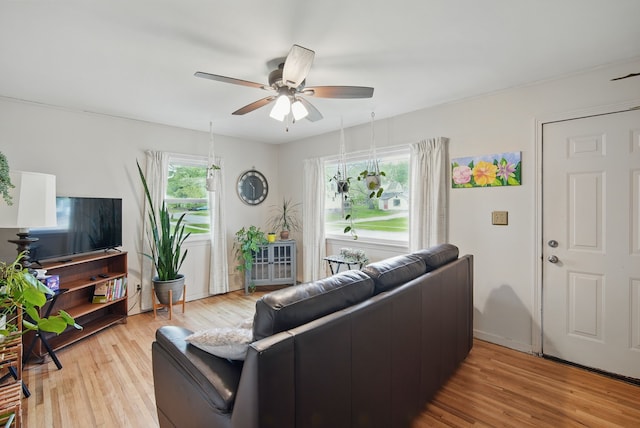 4131 Cornell St, Des Moines, IA 50313 - living room featuring baseboards, ceiling fan, and light wood-style flooring