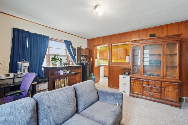 4131 Cornell St, Des Moines, IA 50313 - living room with carpet flooring and wood walls