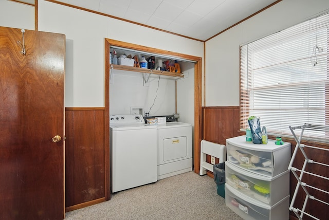 4131 Cornell St, Des Moines, IA 50313 - laundry area featuring a wainscoted wall, ornamental molding, laundry area, and washing machine and dryer