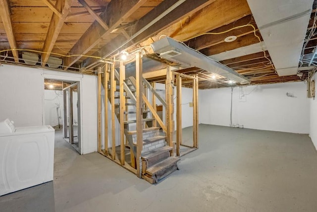 4038 57th St, Des Moines, IA 50310 - unfinished below grade area featuring stairway and washing machine and clothes dryer