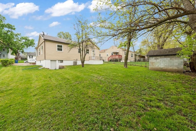 4038 57th St, Des Moines, IA 50310 - view of yard with a shed, an outbuilding, and fence