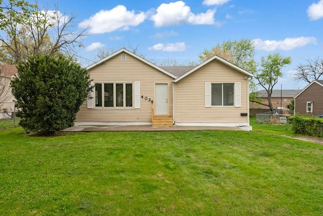 4038 57th St, Des Moines, IA 50310 - rear view of property with entry steps, a yard, and a patio area