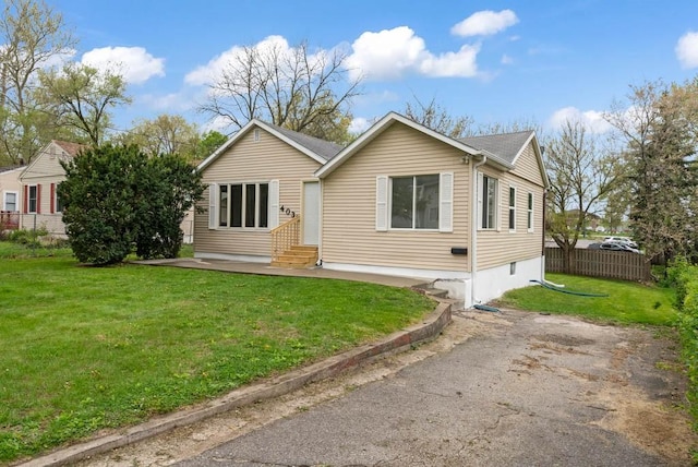 4038 57th St, Des Moines, IA 50310 - rear view of property with a lawn, a patio area, fence, and entry steps