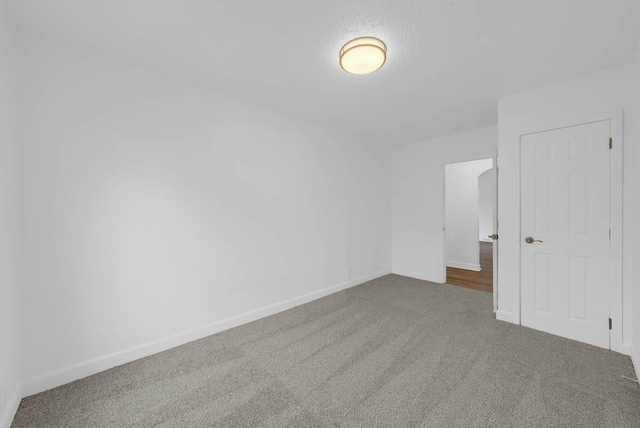 4038 57th St, Des Moines, IA 50310 - empty room with carpet floors and baseboards