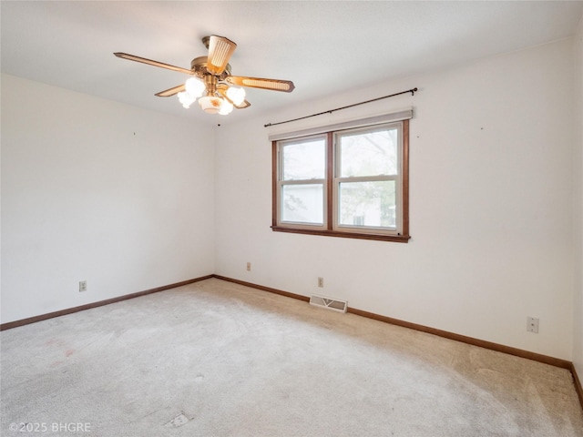 4508 SE 3rd St, Des Moines, IA 50315 - empty room featuring visible vents, baseboards, ceiling fan, and light colored carpet