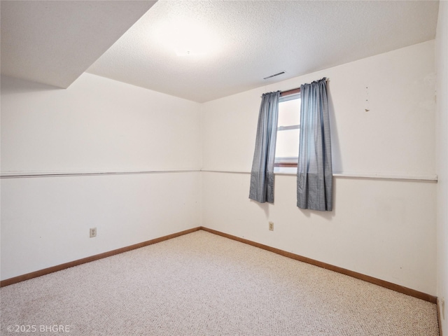4508 SE 3rd St, Des Moines, IA 50315 - carpeted empty room with visible vents and baseboards