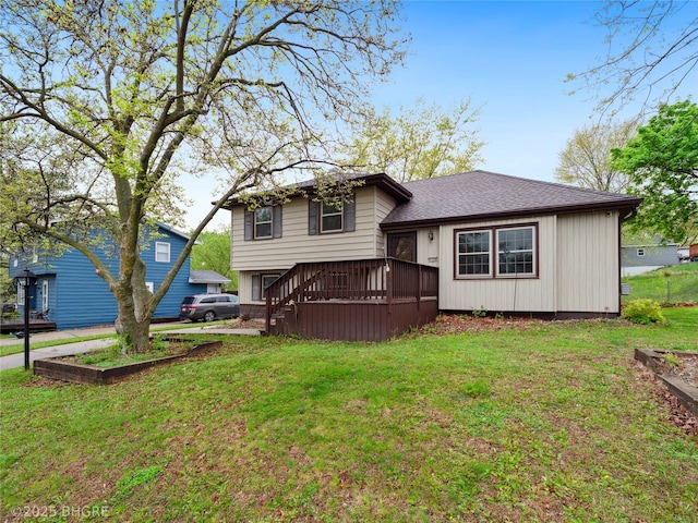 4508 SE 3rd St, Des Moines, IA 50315 - rear view of house featuring a shingled roof, a wooden deck, and a yard