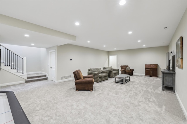 73 Myles Ct, Waukee, IA 50263 - living room featuring light carpet, visible vents, and recessed lighting