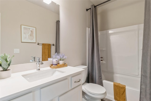 bathroom with vanity, shower / bath combo with shower curtain, and toilet