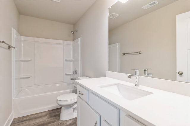 full bathroom featuring visible vents, wood finished floors, toilet, and vanity