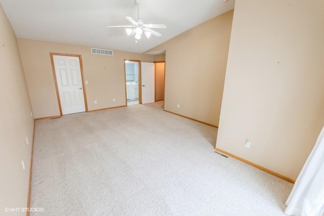 7422 SE 23rd St Unit 6, Des Moines, IA 50320 - unfurnished room with visible vents, light carpet, baseboards, a ceiling fan, and vaulted ceiling