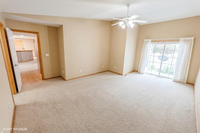 7422 SE 23rd St Unit 6, Des Moines, IA 50320 - unfurnished room featuring baseboards, ceiling fan, and light carpet