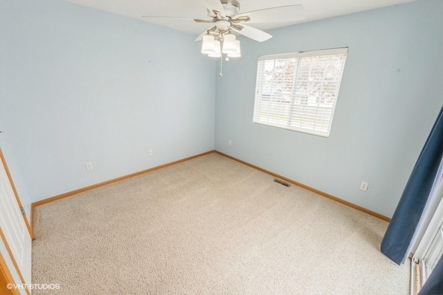 7422 SE 23rd St Unit 6, Des Moines, IA 50320 - carpeted empty room featuring baseboards, visible vents, and ceiling fan