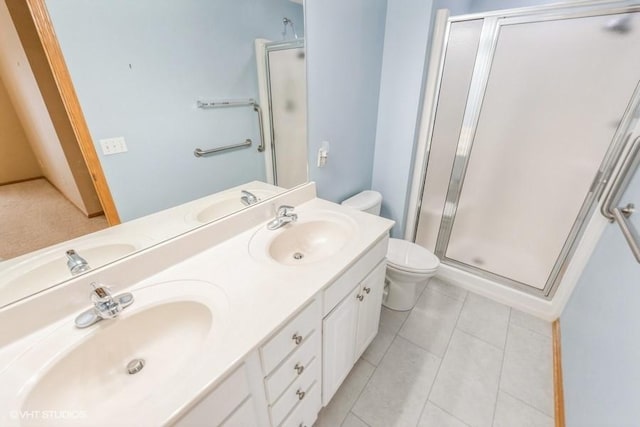 7422 SE 23rd St Unit 6, Des Moines, IA 50320 - full bathroom with double vanity, a sink, a stall shower, and toilet