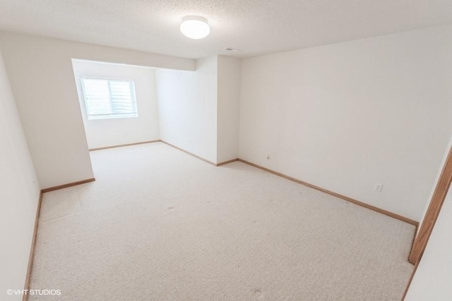 7422 SE 23rd St Unit 6, Des Moines, IA 50320 - carpeted empty room featuring a textured ceiling and baseboards