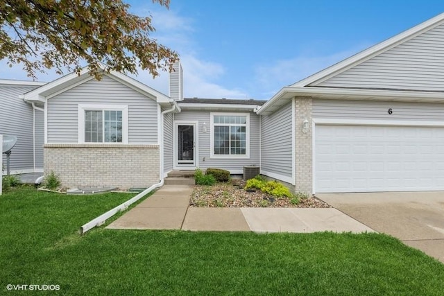 7422 SE 23rd St Unit 6, Des Moines, IA 50320 - ranch-style house featuring brick siding, a garage, a front yard, a chimney, and concrete driveway