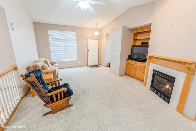 7422 SE 23rd St Unit 6, Des Moines, IA 50320 - living area with lofted ceiling, light carpet, baseboards, ceiling fan, and a tile fireplace