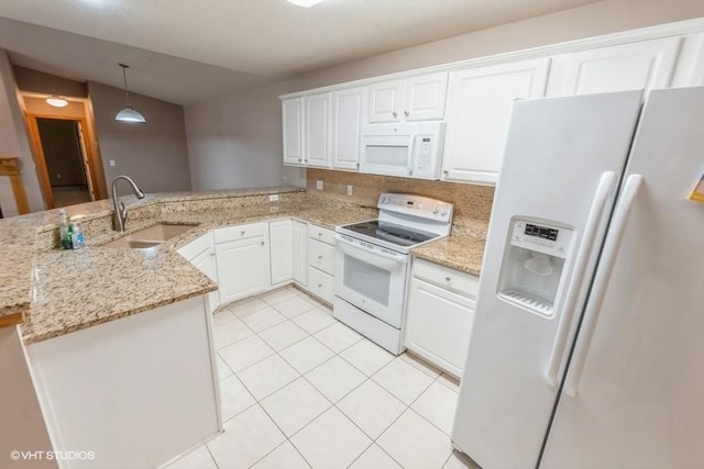 7422 SE 23rd St Unit 6, Des Moines, IA 50320 - kitchen featuring white appliances, a peninsula, white cabinets, and a sink