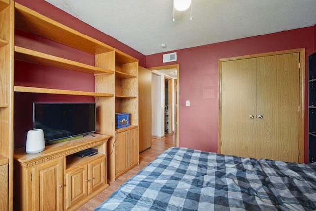 4202 62nd St Unit 6, Urbandale, IA 50322 - bedroom with a closet, light wood finished floors, and visible vents