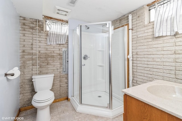 full bathroom with baseboards, a stall shower, toilet, and visible vents