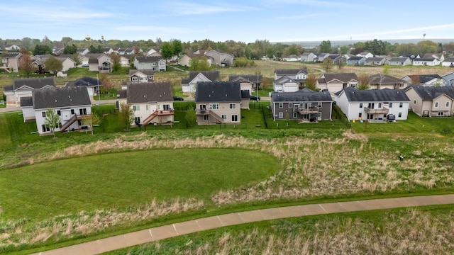 birds eye view of property with a residential view