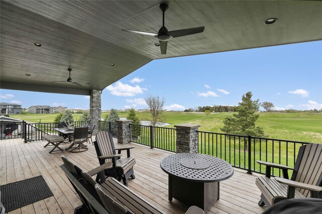 5129 NE Seneca Dr, Ankeny, IA 50021 - deck with a ceiling fan, outdoor dining space, golf course view, and a yard