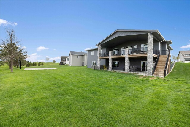 5129 NE Seneca Dr, Ankeny, IA 50021 - rear view of property with a lawn, a patio, stairs, and a wooden deck