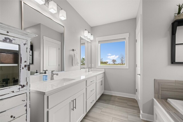 5129 NE Seneca Dr, Ankeny, IA 50021 - bathroom with double vanity and a bath