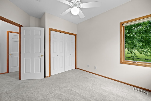 5099 Clover Ridge Rd, Panora, IA 50216 - unfurnished bedroom with a ceiling fan, visible vents, carpet, and a closet