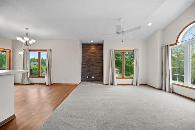 5099 Clover Ridge Rd, Panora, IA 50216 - empty room with baseboards, ceiling fan with notable chandelier, recessed lighting, and wood finished floors