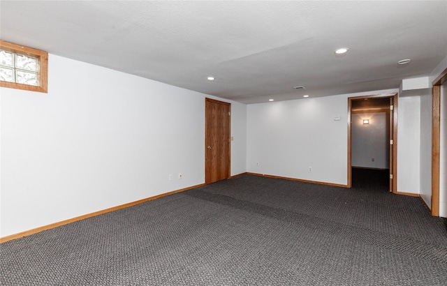 interior space with recessed lighting, baseboards, and dark colored carpet
