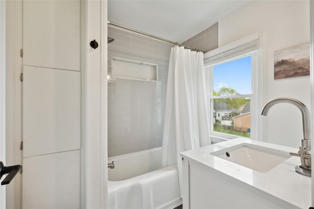 bathroom featuring vanity and shower / tub combo