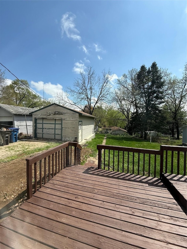 deck featuring a detached garage and an outdoor structure