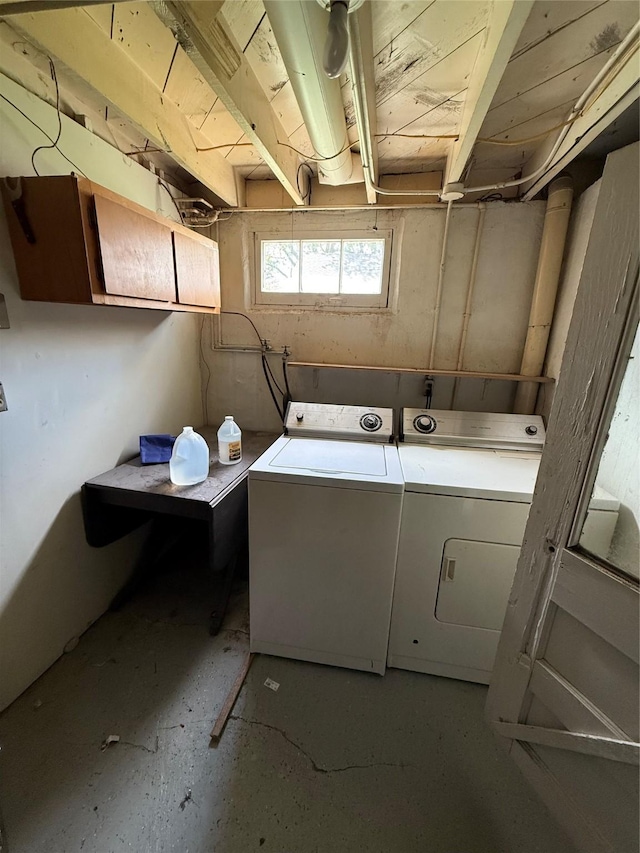 washroom featuring laundry area and washer and dryer