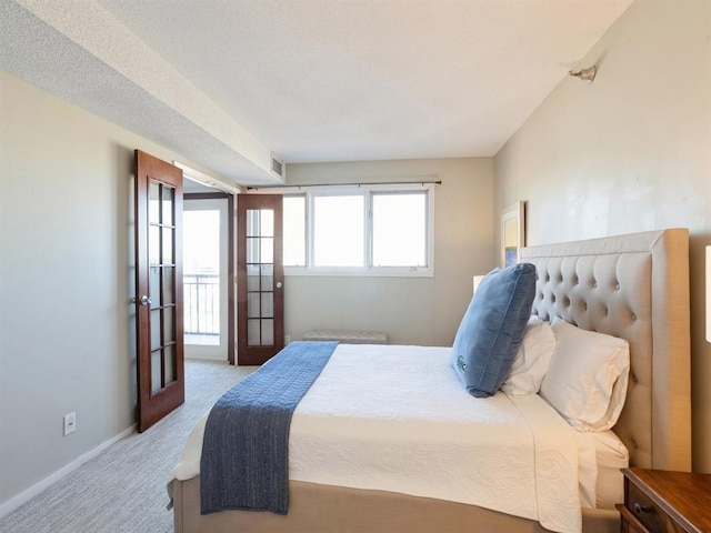 bedroom featuring baseboards, carpet flooring, and visible vents