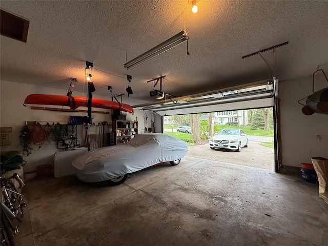 garage with visible vents and a garage door opener