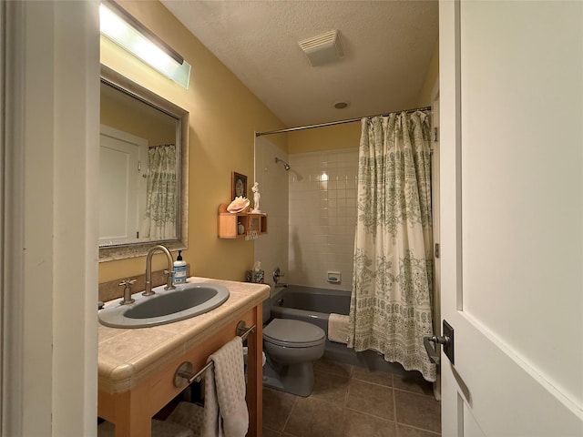 bathroom featuring tile patterned flooring, vanity, toilet, shower / tub combo, and visible vents