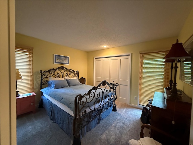 carpeted bedroom featuring a closet