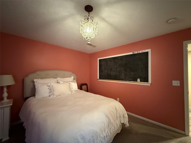 956 55th St, West Des Moines, IA 50266 - bedroom with carpet flooring and a chandelier
