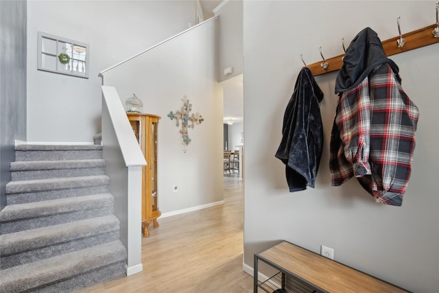 interior space with baseboards and wood finished floors
