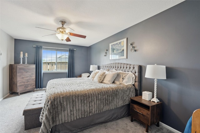 bedroom with carpet floors, a ceiling fan, and baseboards