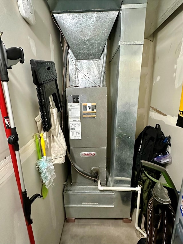 utility room with heating unit