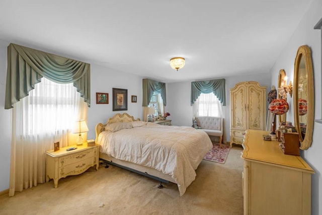 bedroom with light carpet